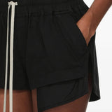 Black shorts worn by a person, showing the shorts fit