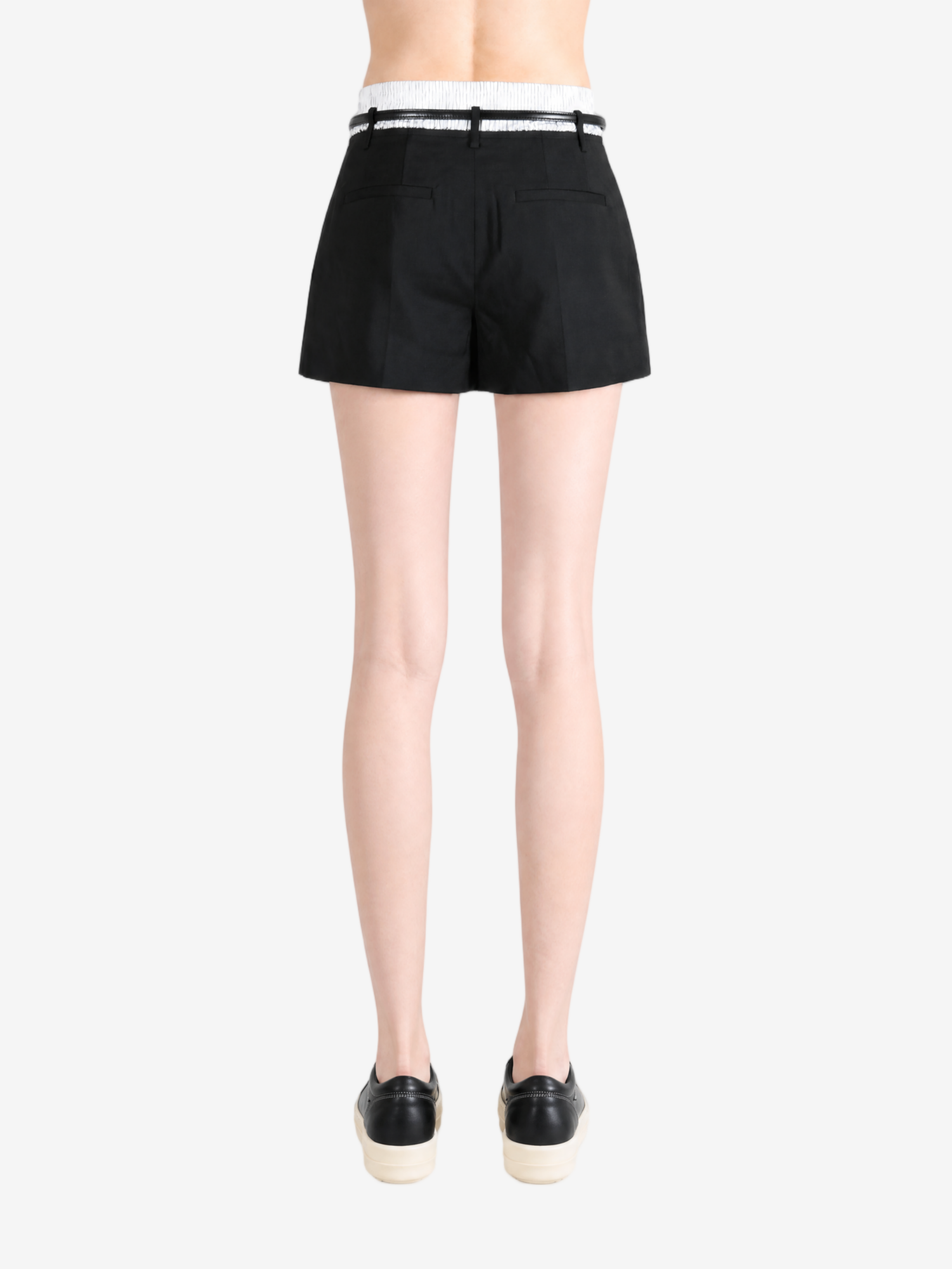 Black shorts worn by a person, showing the shorts fit