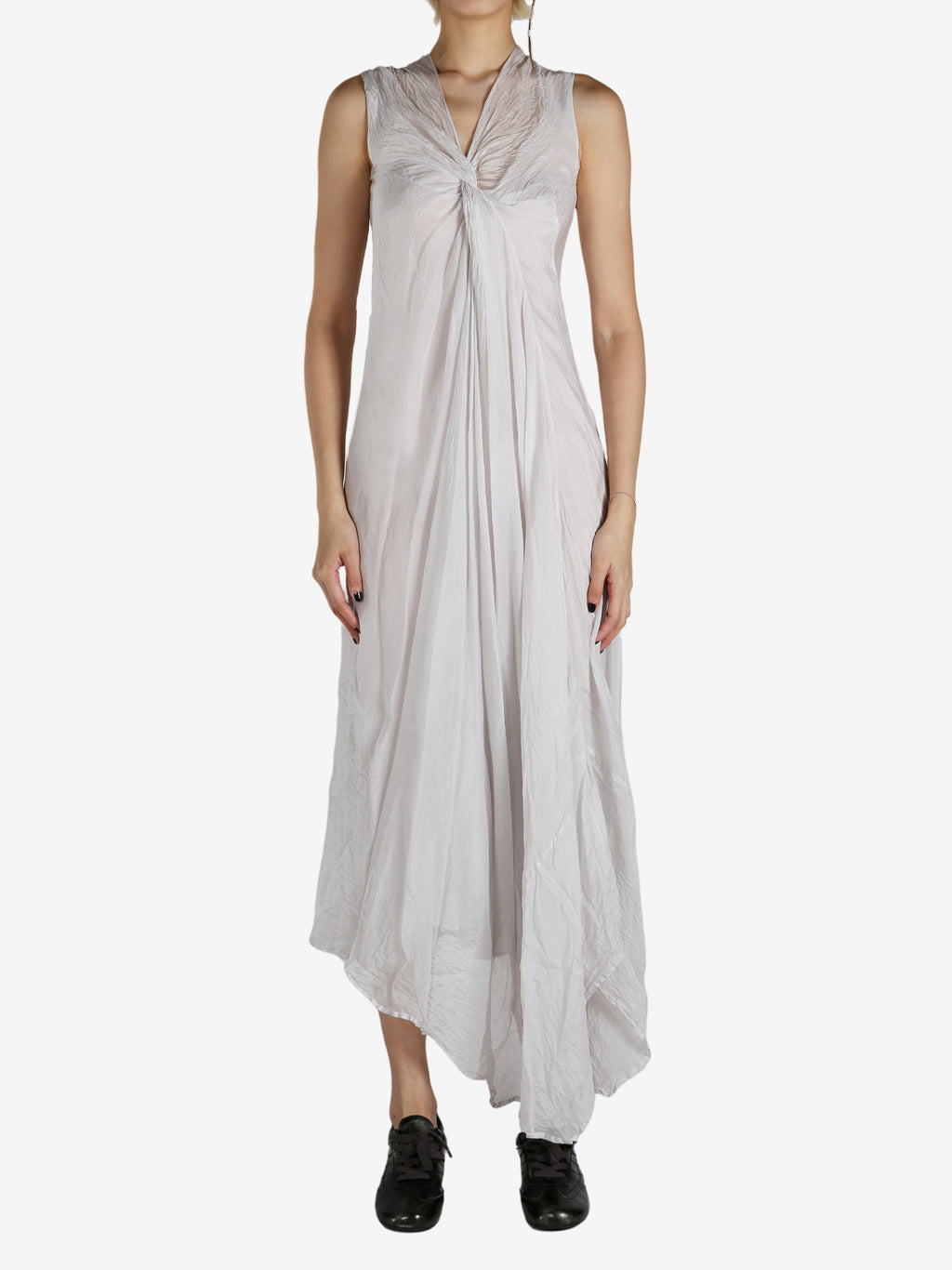 White dress worn by a person, showing the dress's fit