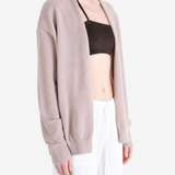 Tan knitwear worn by a person, showing the knitwear fit