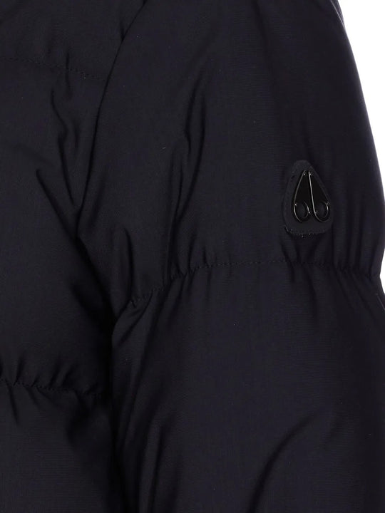 Close up of the black coat, showing texture of the nylon fabric