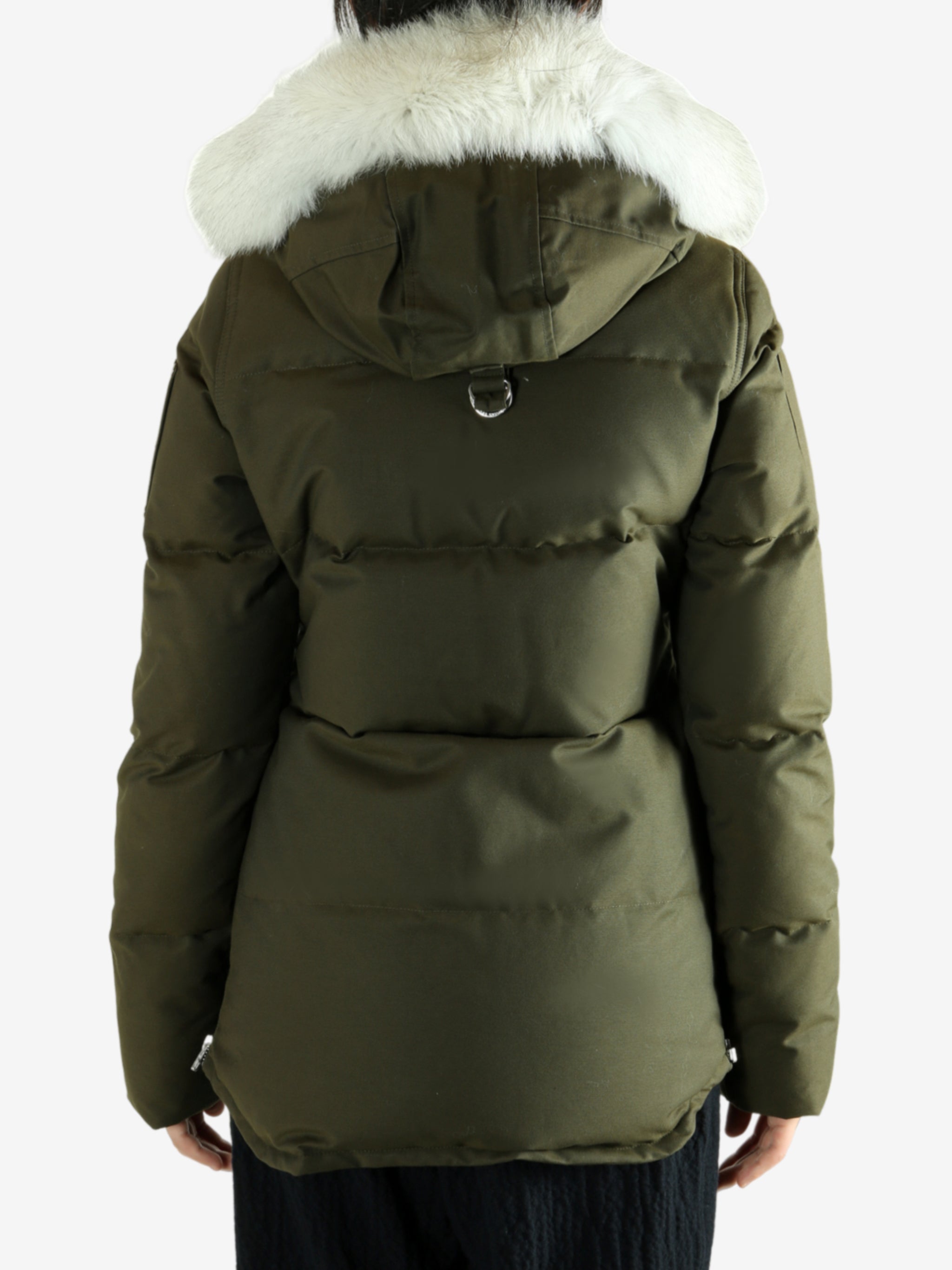 Green jackets worn by a person, showing the jackets fit