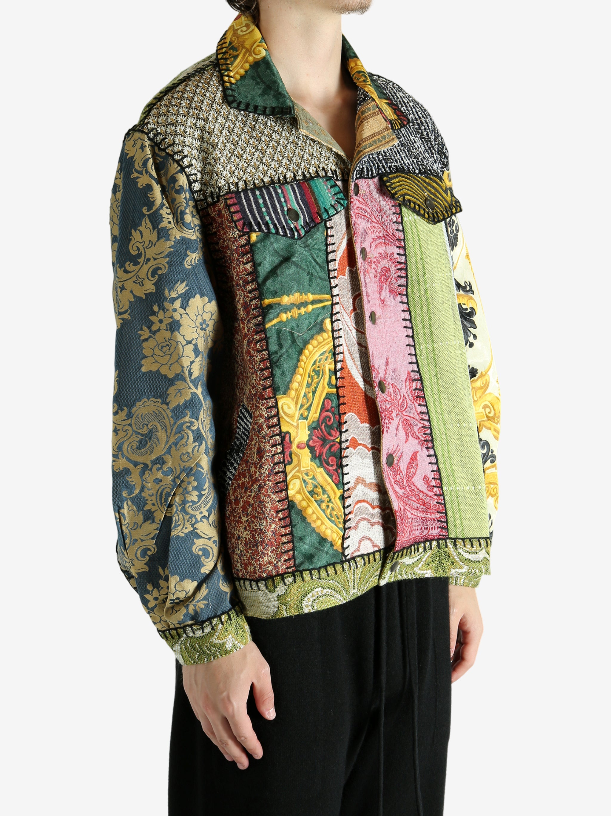 Green jacket worn by a person, showing the jacket‘s fit