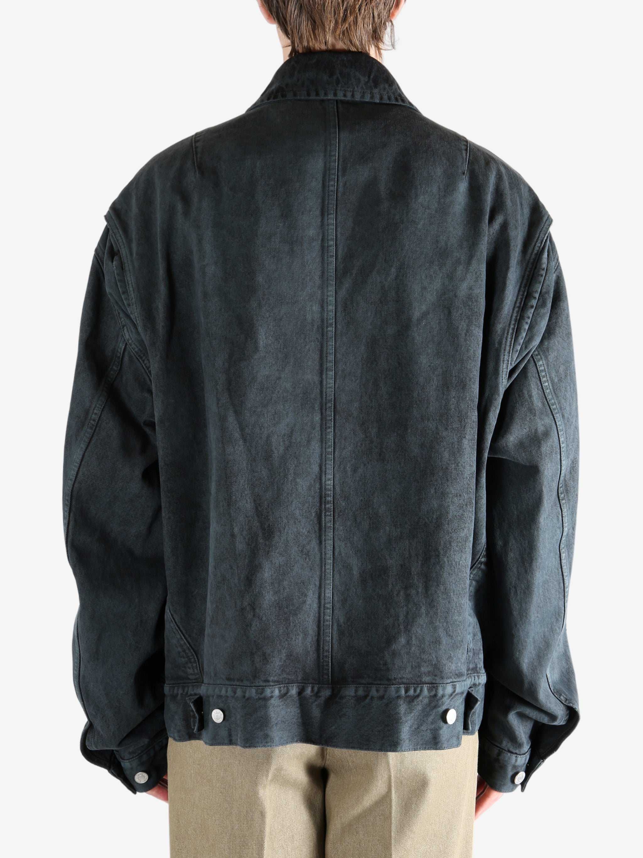 Blue jacket worn by a person, showing the jacket's fit