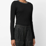 Black tops worn by a person, showing the tops fit