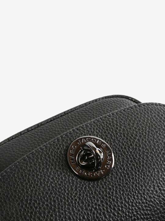 Close up of black bag, showing texture of the cow leather fabric