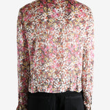 Pink shirt worn by a person, showing the shirt's fit