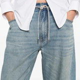 Cloes-up of blue jeans, showing texture of cotton fabric