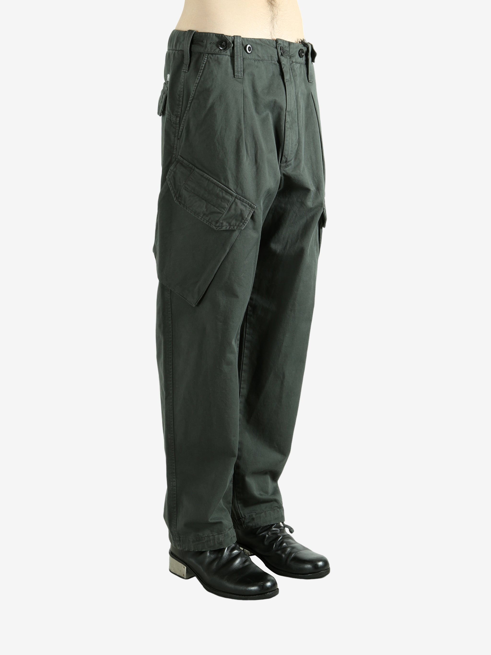 Green pants worn by a person, showing the pants fit