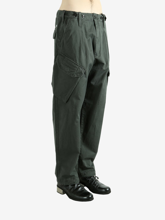 Green pants worn by a person, showing the pants fit