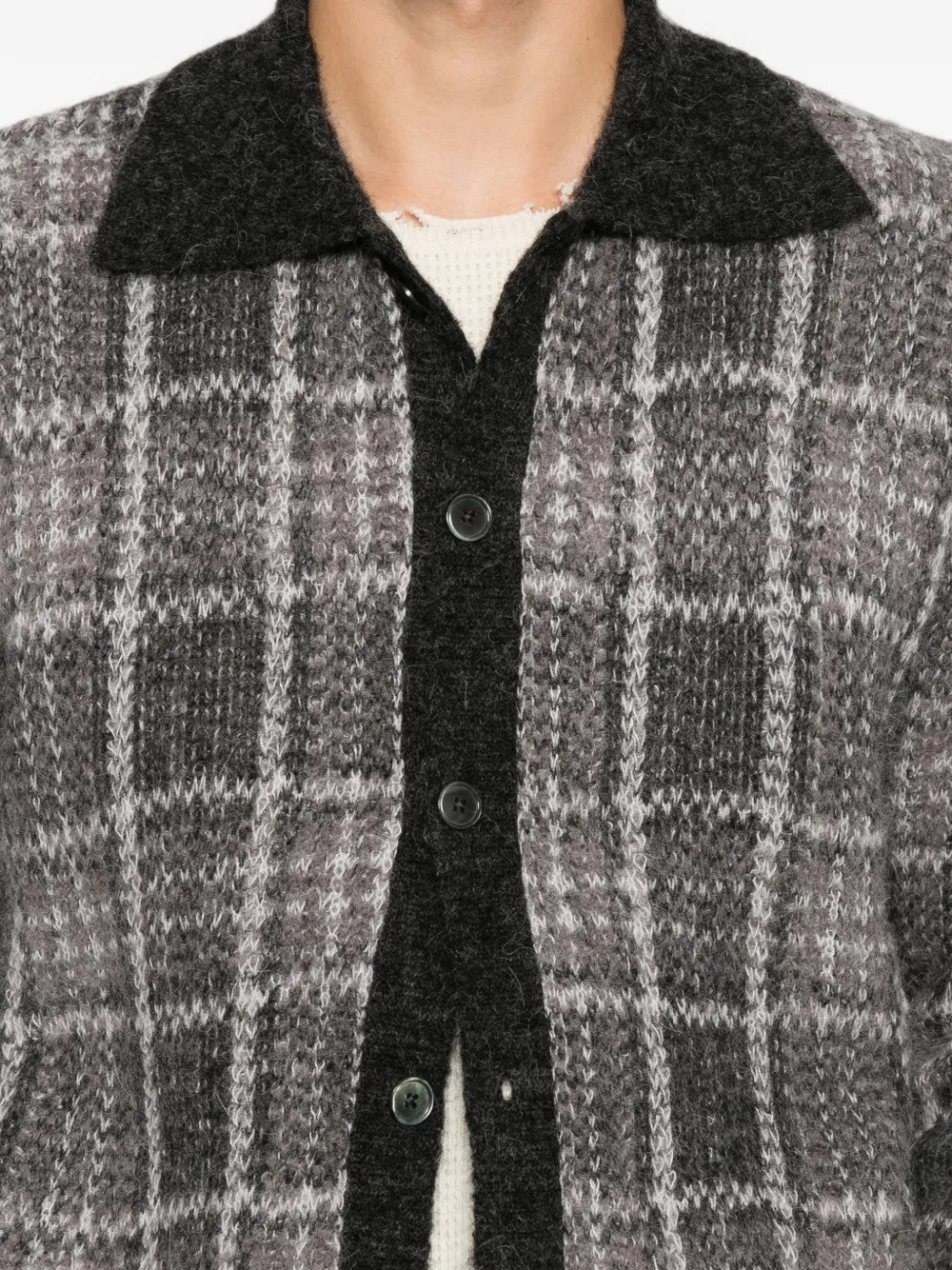 Grey shirt worn by a person, showing the shirt fit