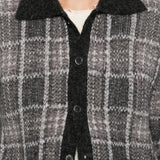 Grey shirt worn by a person, showing the shirt fit