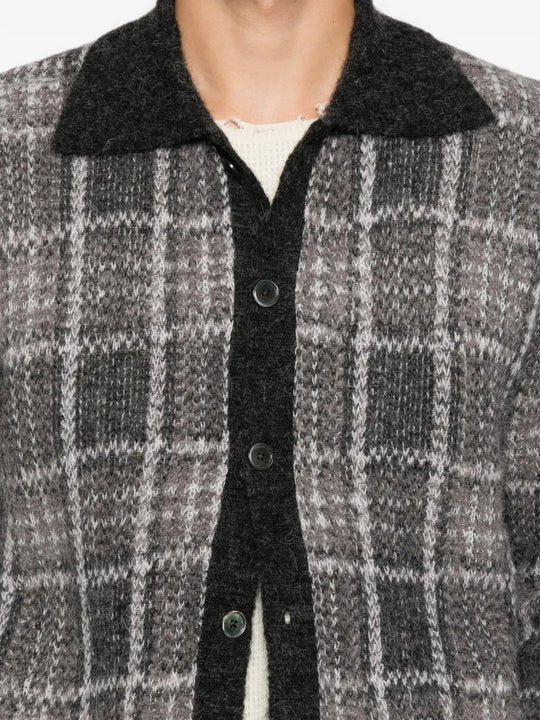 Grey shirt worn by a person, showing the shirt fit