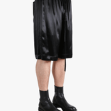 Black short worn by a person, showing the short fit