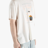 White t-shirt worn by a person, showing the shirt's fit