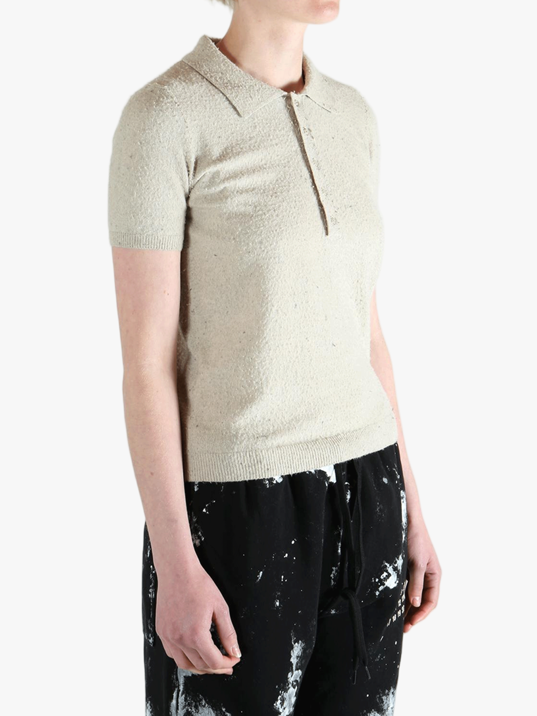 White t-shirts worn by a person, showing the t-shirts fit