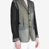 Grey jacket worn by a person, showing the jacket fit