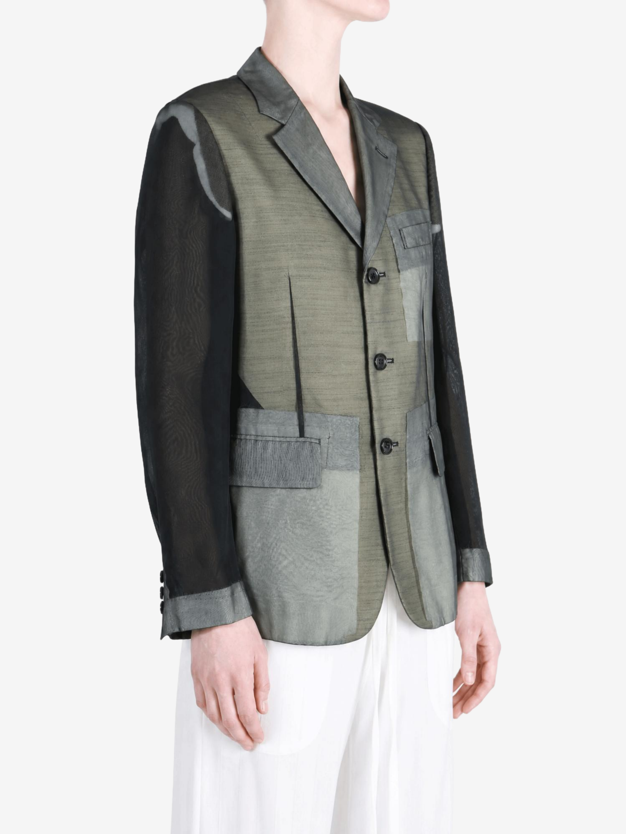 Grey jacket worn by a person, showing the jacket fit