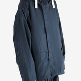 Navy jacket worn by a person, showing the jacket's fit