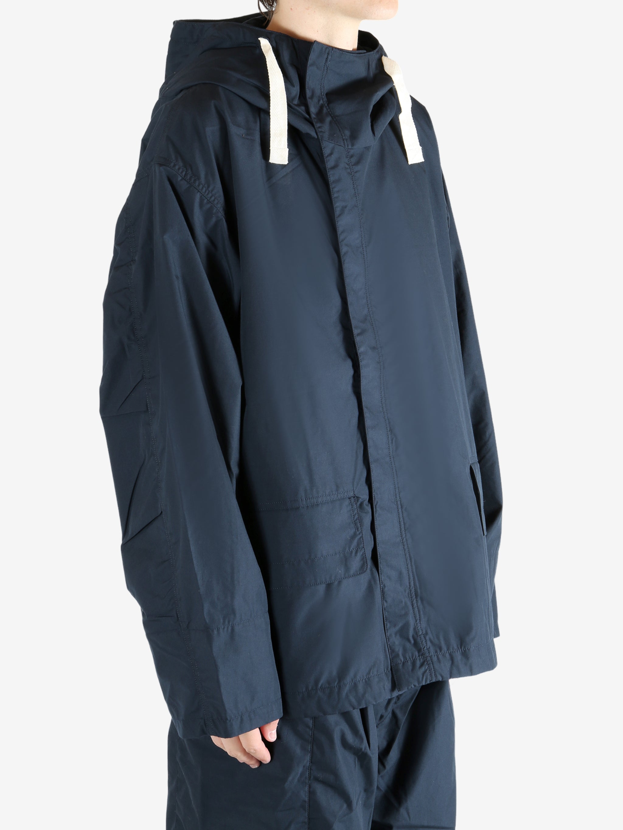 Navy jacket worn by a person, showing the jacket's fit