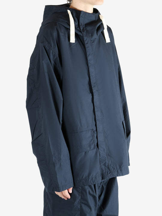 Navy jacket worn by a person, showing the jacket's fit