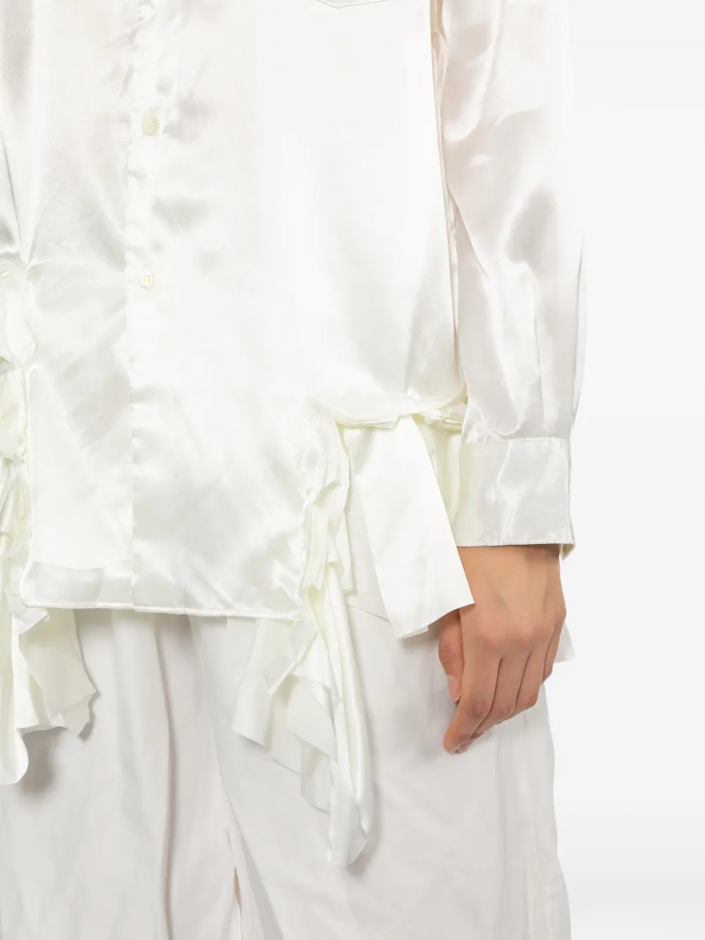 White shirt worn by a person, showing the shirt fit