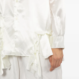 White shirt worn by a person, showing the shirt fit