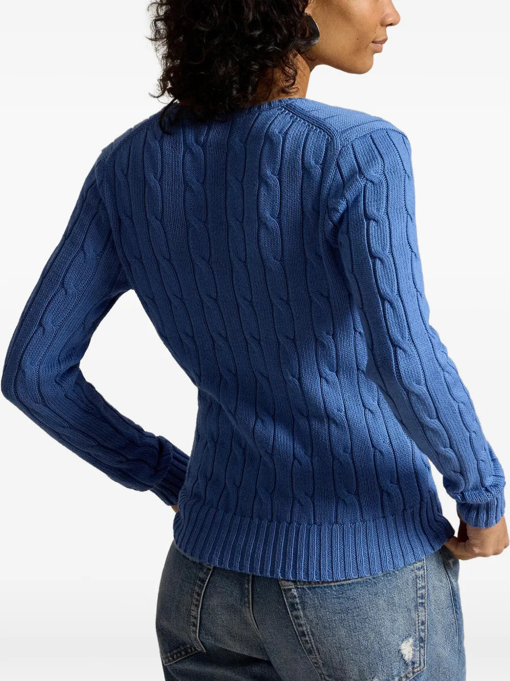 Blue knitwear worn by a person, showing the knitwear fit