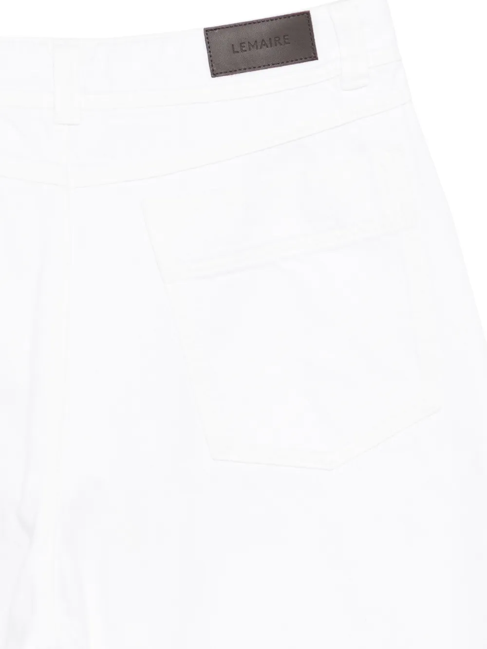 Close up of white pant, showing texture of the cotton fabric