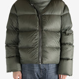 Green jacket worn by a person, showing the jacket's fit