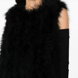 Close up of the black gilet, showing texture of the turkey feather fabric