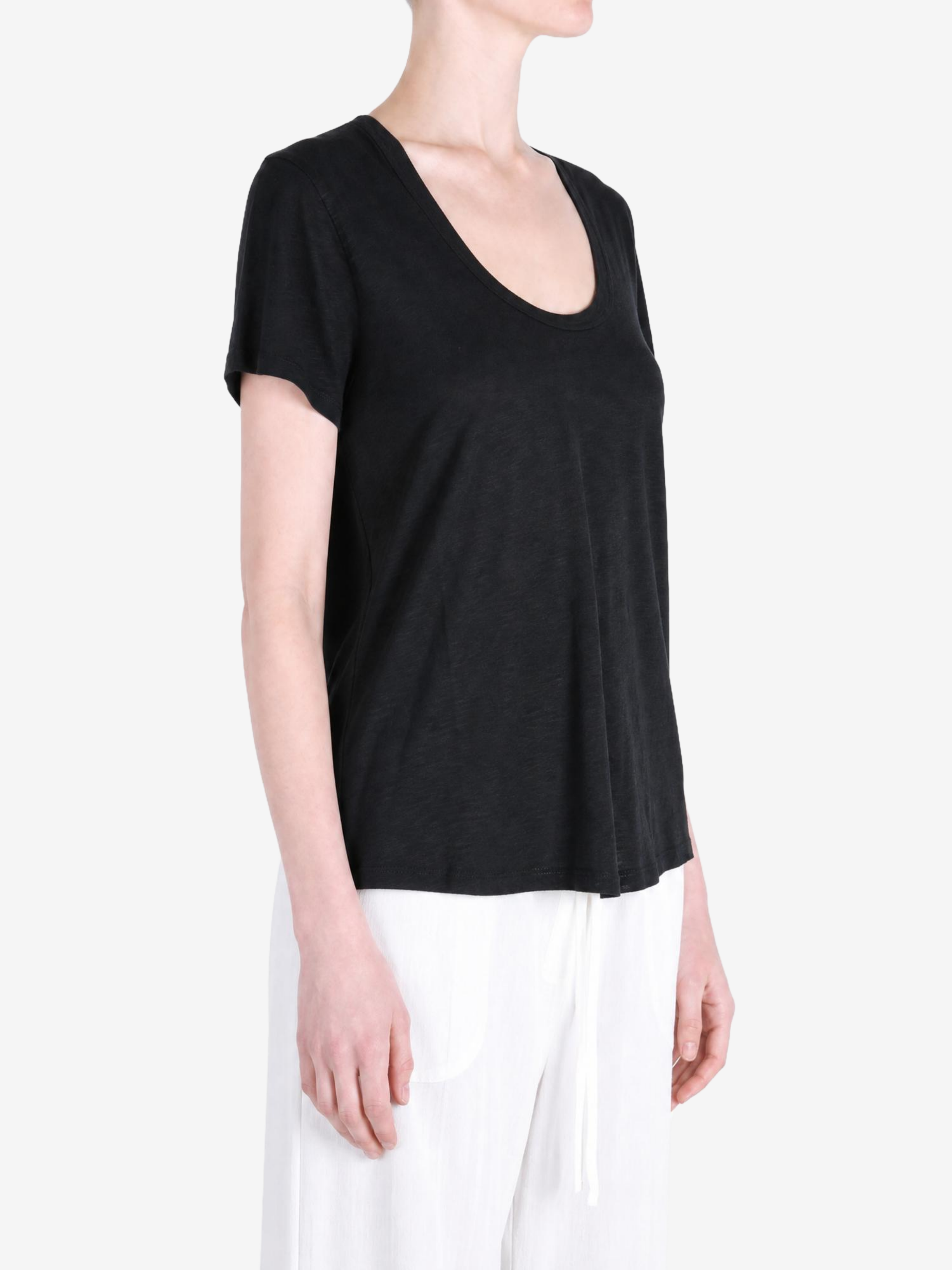 Black t-shirt worn by a person, showing the t-shirt fit