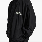 Black jacket worn by a person, showing the jacket fit