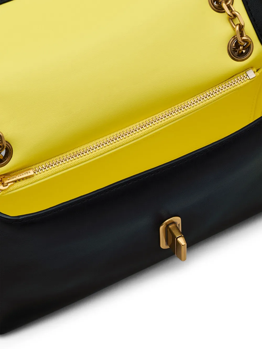 close up of black bags, showing texture of the leather fabric