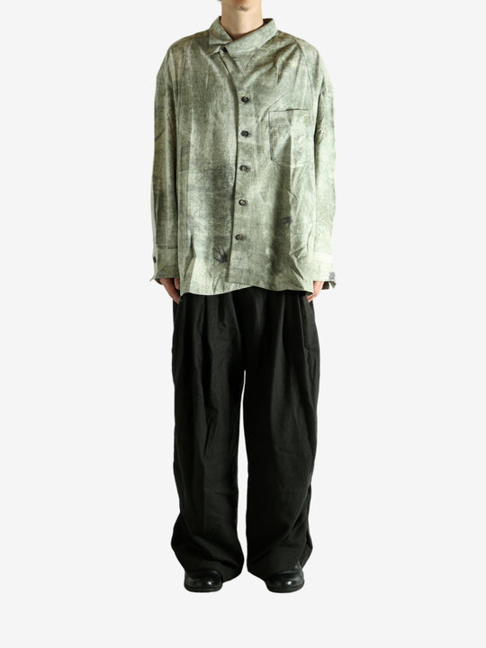 Green shirt worn by a person, showing the shirt's fit