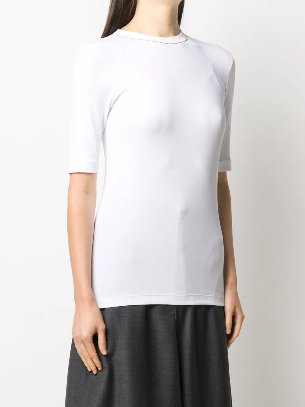 White t-shirt worn by a person, showing the t-shirt fit
