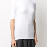White t-shirt worn by a person, showing the t-shirt fit