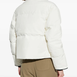 White jacket worn by a person, showing the jacket fit