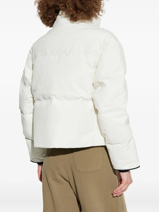 White jacket worn by a person, showing the jacket fit