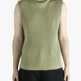 Green top worn by a person, showing the top's fit
