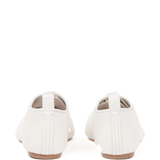 white flats, back view