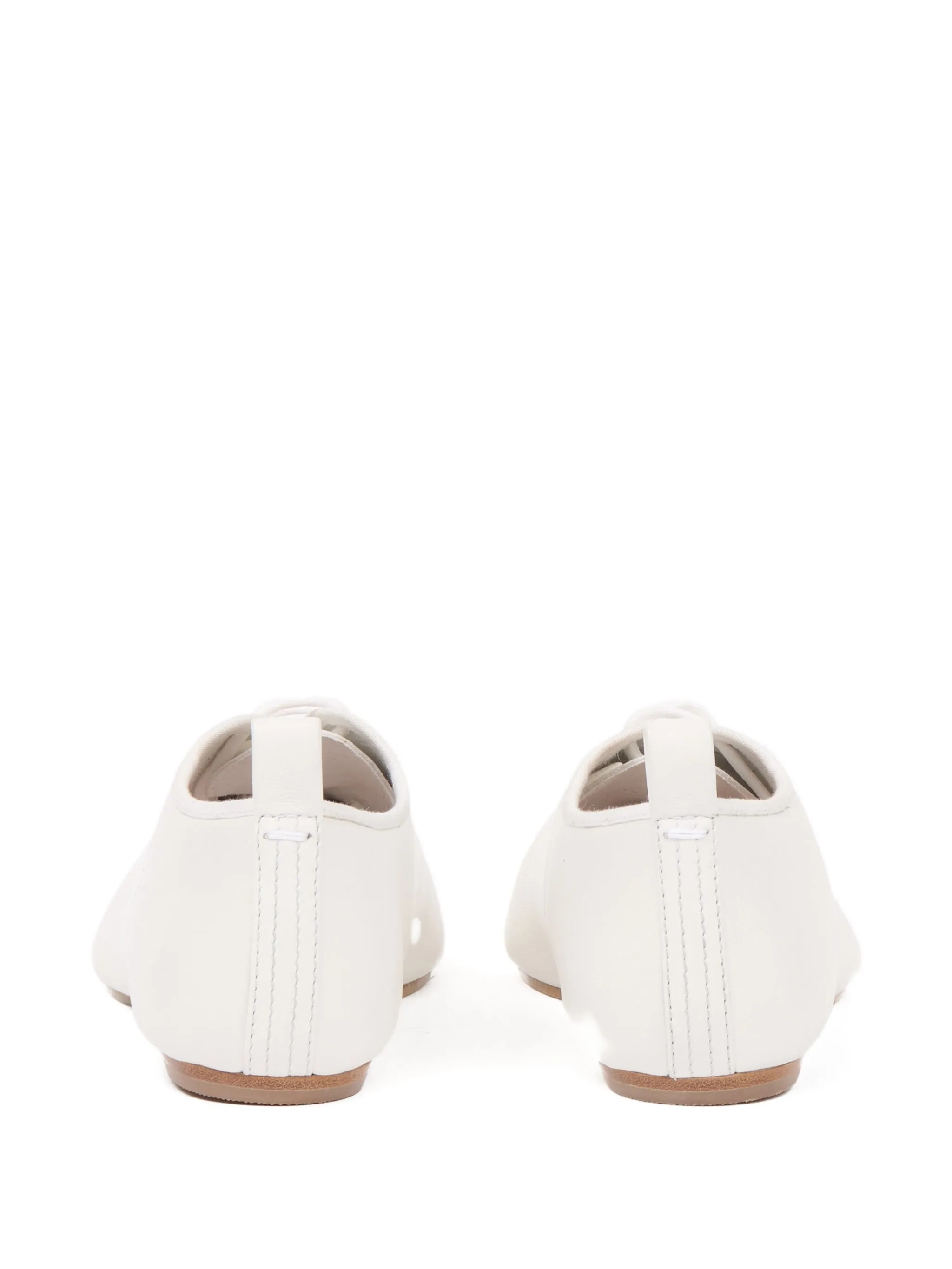 white flats, back view