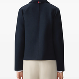 Navy jacket worn by a person, showing the jacket fit