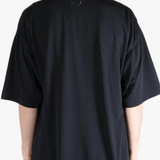 Black t-shirt worn by a person, showing the t-shirt's fit