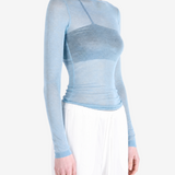 Blue top worn by a person, showing the top fit