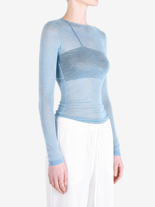 Blue top worn by a person, showing the top fit