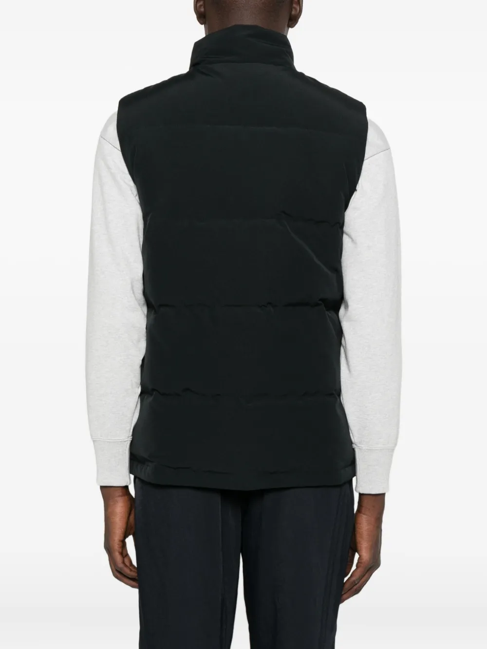 Black vest worn by a person, showing the vest fit