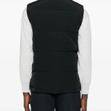 Black vest worn by a person, showing the vest fit
