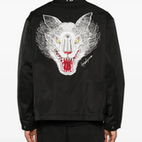 Black jacket worn by a person, showing the jacket's fit