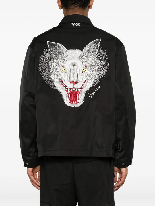 Black jacket worn by a person, showing the jacket's fit